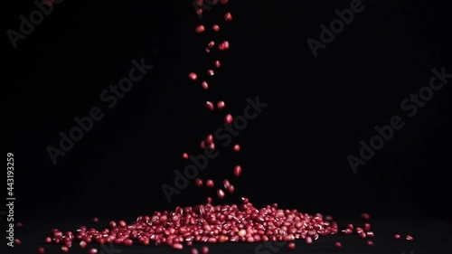 Organic red beans sprinkled on black background photo