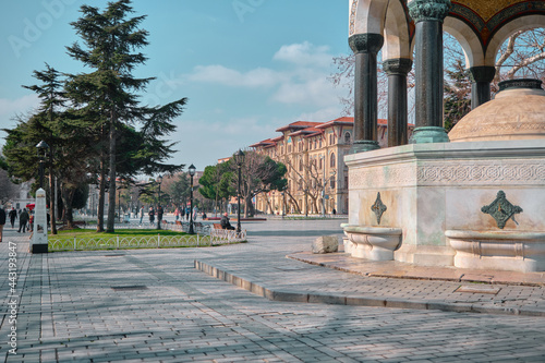 Turkey istanbul 03.03.2021.Sultanahmet square and old ancient public fountain established by ottoman empire period with magnificent engravings and painting called as german fountain (alman cesmesi) photo