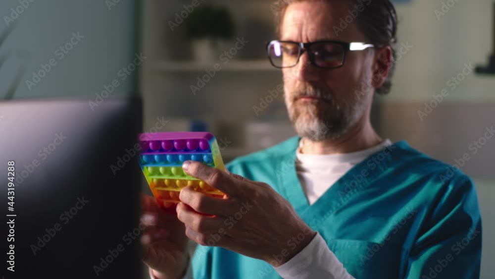 custom made wallpaper toronto digitalMature medical practitioner examining and playing with fidget toy