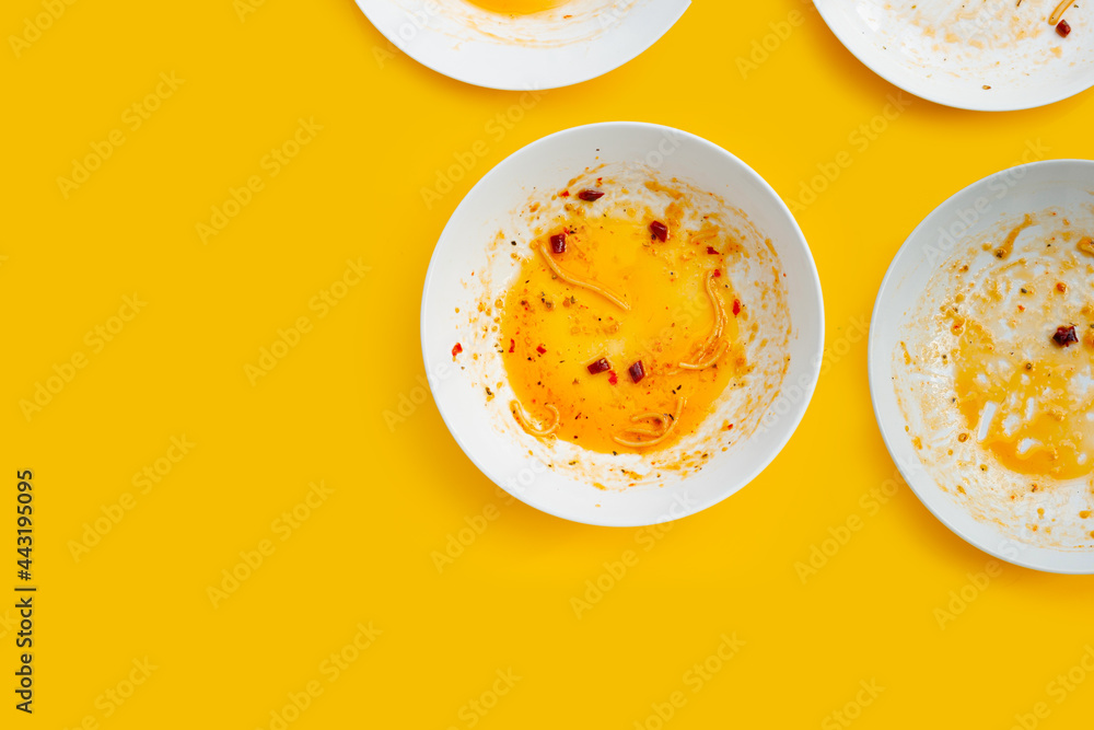 Dirty dishes on yellow background. Dirty dishes on yellow background.