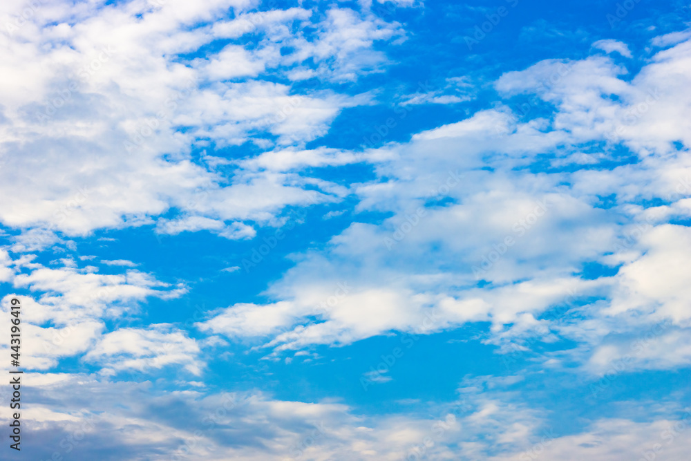 Evening blue sky with white clouds