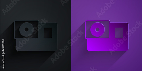 Paper cut Action extreme camera icon isolated on black on purple background. Video camera equipment for filming extreme sports. Paper art style. Vector