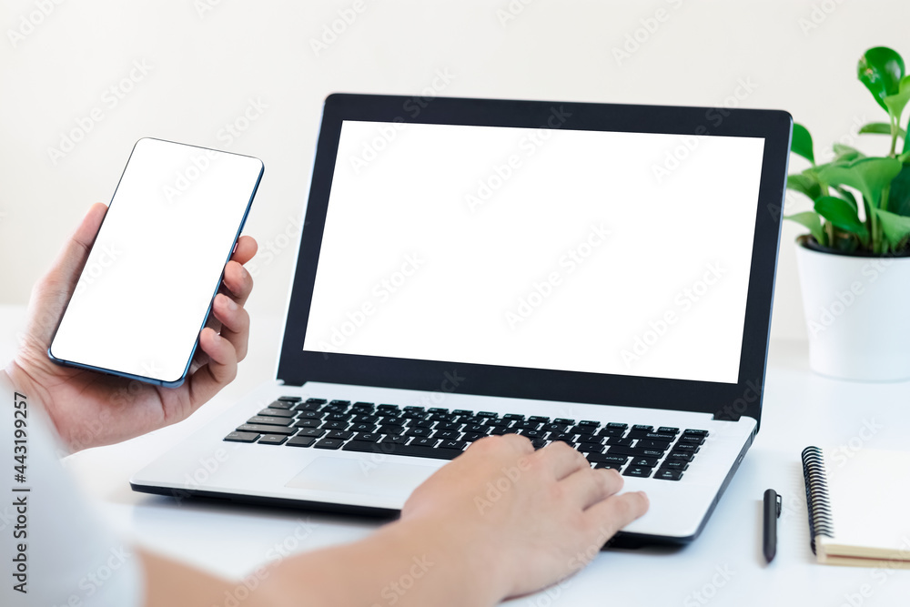 Mockup Copy Space Computer Notebook Laptop Concept , a man's hand using a laptop on internet websites at the office, keyboards on laptop computer with balnk copy screen for your advertising content. Mockup Copy Space Computer Notebook Laptop Concept , a man's hand using a laptop on internet websites at the office, keyboards on laptop computer with balnk copy screen for your advertising content.