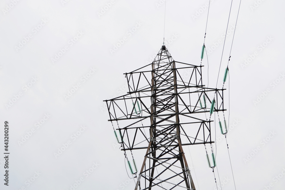 Electric tower with wires on the background of the sky. Electric tower with wires on the background of the sky.