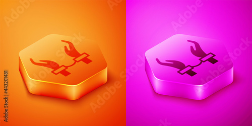 Isometric Handcuffs on hands of criminal man icon isolated on orange and pink background. Arrested man in handcuffs. A crime, arrest, business and corruption concept. Hexagon button. Vector