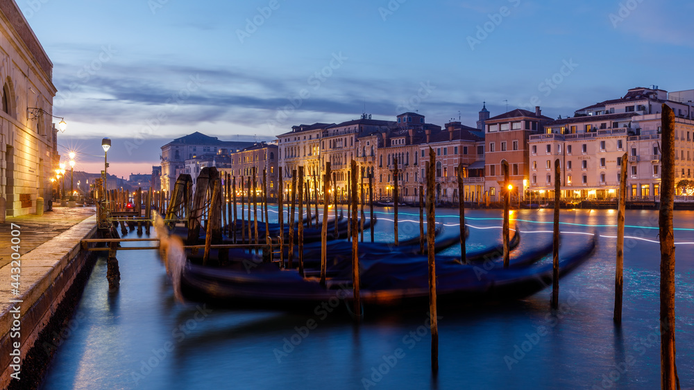 Naklejka premium Venice city Grand Canal at sunset with gondolas and trails