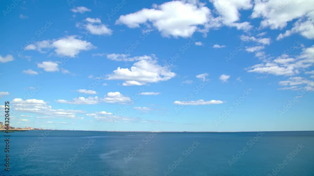 Blue sea and white cloudscape in blue sky, time-lapse Blue sea and white cloudscape in blue sky, time-lapse