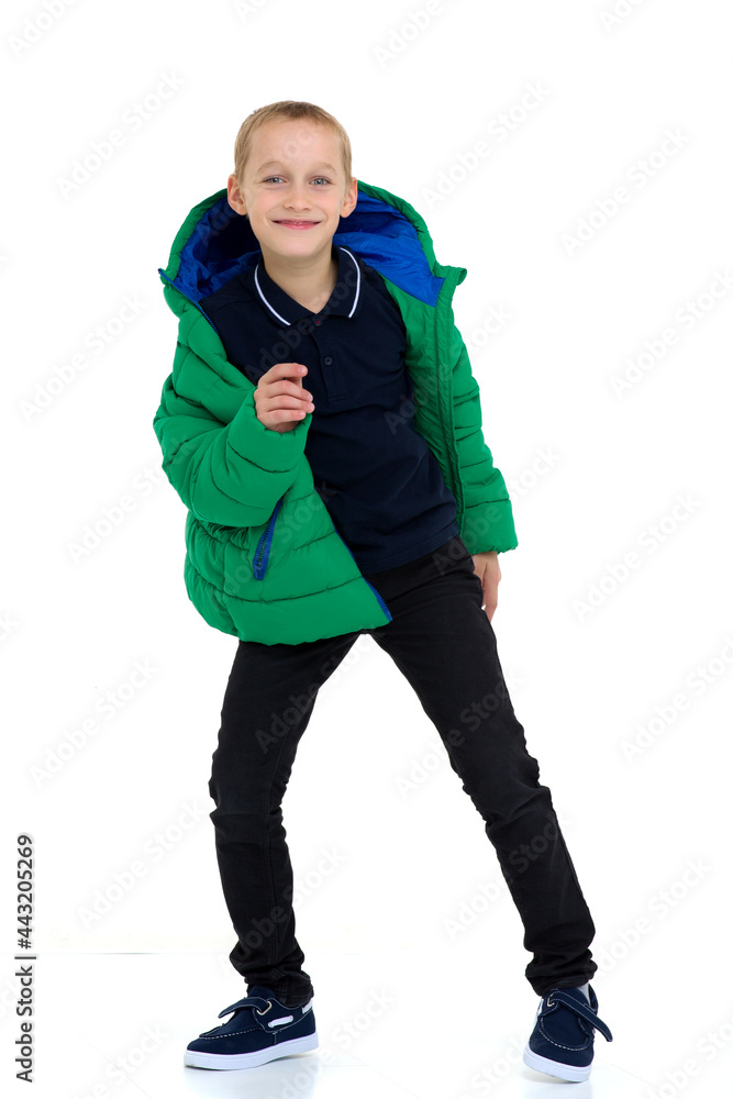 Fototapeta premium Smiling boy in unbuttoned green winter jacket