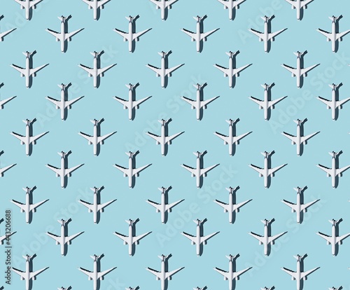 Pattern of plane models on blue pastel background