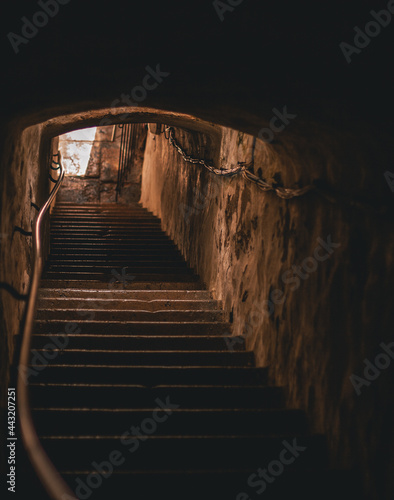 Stairs up out of the tunnel where the golden sun shines. Dramatic feeling. Hiiumaa, Estonia
