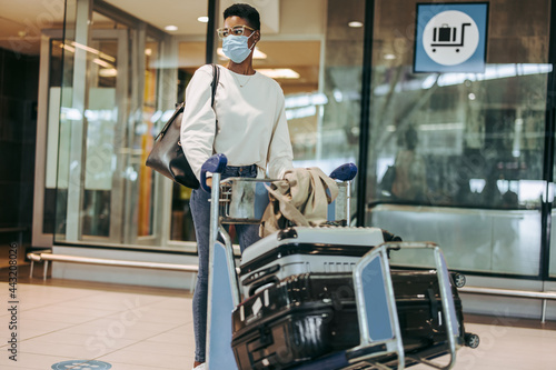 Woman at airport flying during pandemic