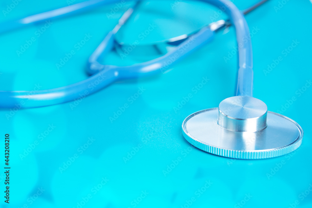 stethoscope blue background, healthcare treatment and medicine concept