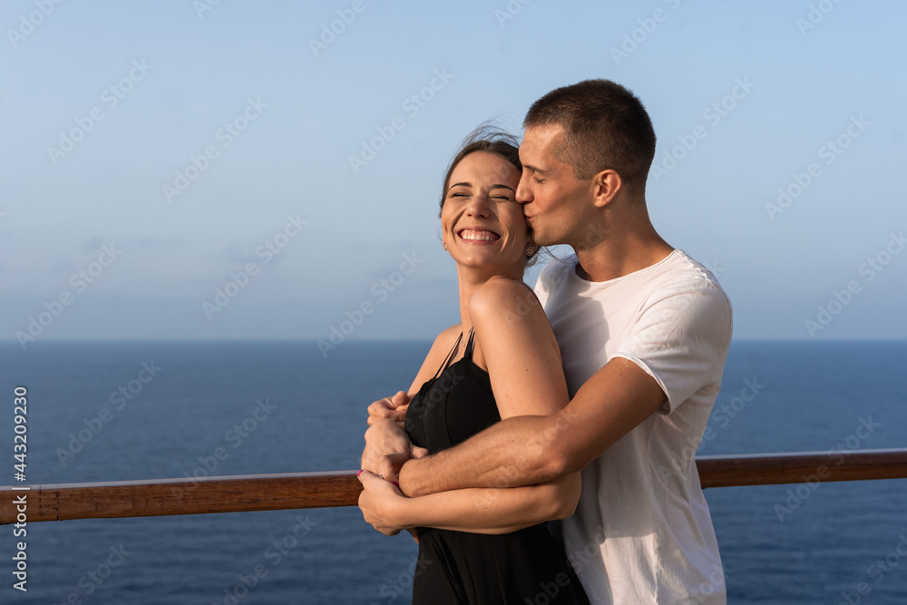 Young couple in love enjoying their honeymoon trip on a cruise ship Young couple in love enjoying their honeymoon trip on a cruise ship