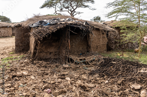 houses of a Maasai village made of wicker branches and clay with protection from thorns from wild animals 
