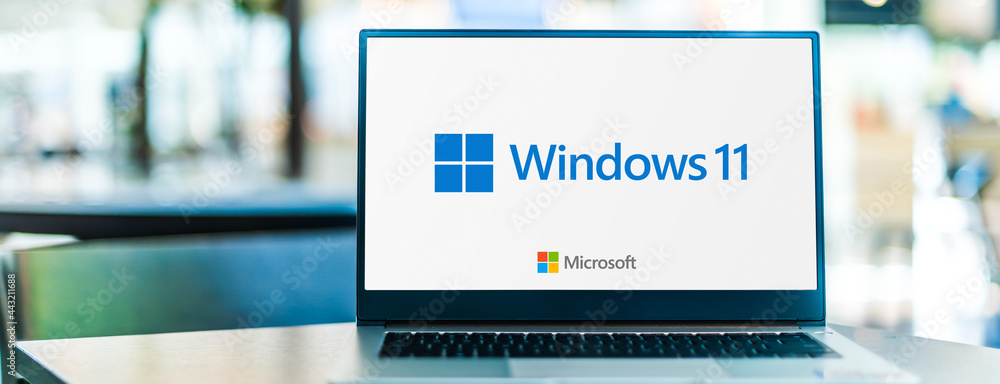 Laptop computer displaying logo of Windows 11 Stock Photo | Adobe Stock