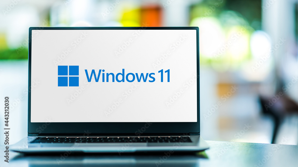 Laptop computer displaying logo of Windows 11 Stock Photo | Adobe Stock