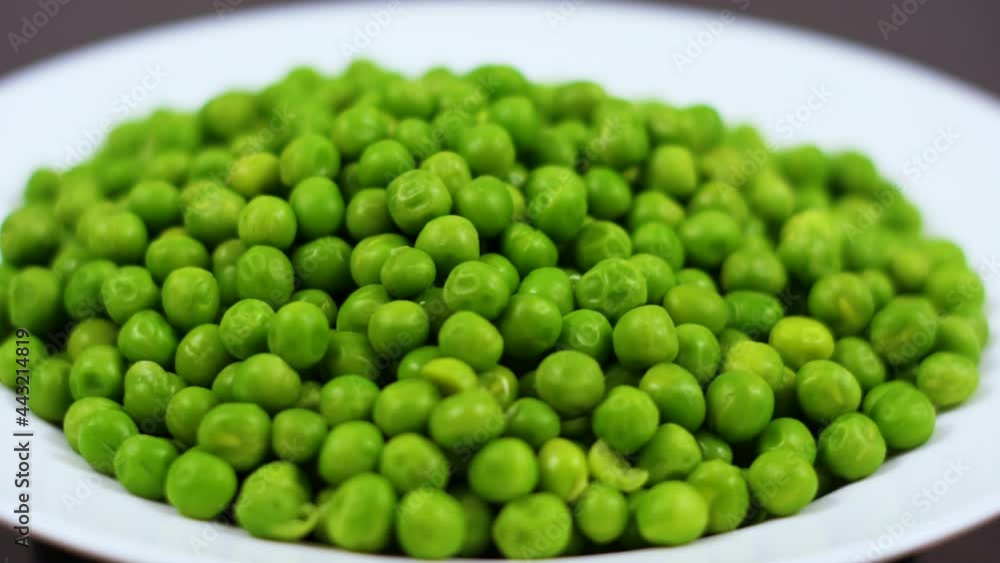 Close Up Green Peas Background Rotating. Macro Shot Fresh Organic Green Peas. Vegetable Harvest Healthy Eating. Beautiful Texture Close-up of Fresh Green Peas. Healthy Vegetarian food. Close Up Green Peas Background Rotating. Macro Shot Fresh Organic Green Peas. Vegetable Harvest Healthy Eating. Beautiful Texture Close-up of Fresh Green Peas. Healthy Vegetarian food.