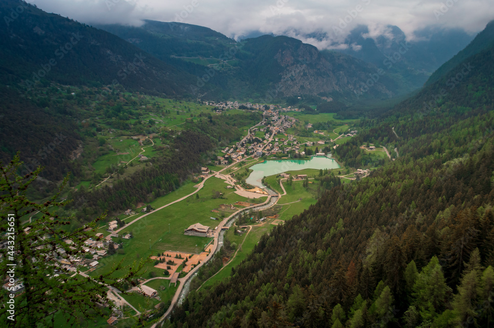 Aerial view of the little mountain town of Brusson with its nice lake in Ayas valley in Val D'Aosta, Italy
