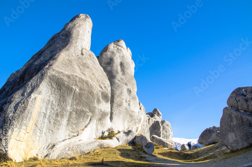 Giant rocks on the hill in New Zealand with blue sky.