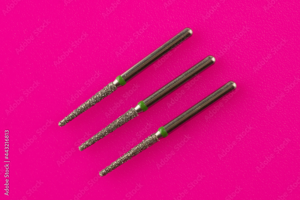 dental burs on a pink background dental burs on a pink background