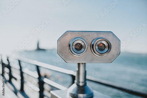 Binoculars telescope on observation deck for tourist. Coin operated electronic tourist binoculars