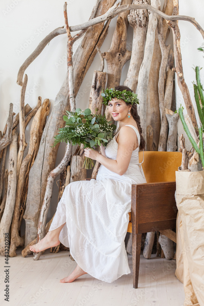 Obraz premium Shot of a pregnant woman sitting on armchair and relaxing