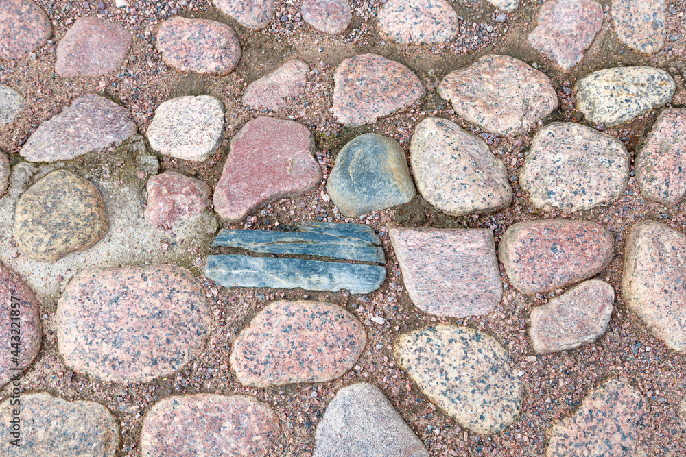 large stones lie in the sand, close-up, stone texture large stones lie in the sand, close-up, stone texture