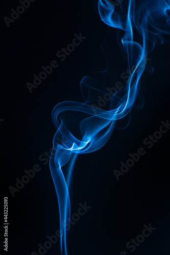 Blue smoke isolated on black background.