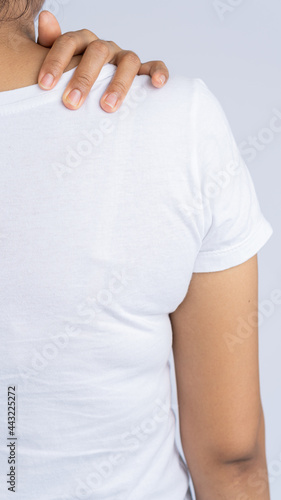 Wallpaper Mural Young woman with shoulder pain and body, medical concept Torontodigital.ca