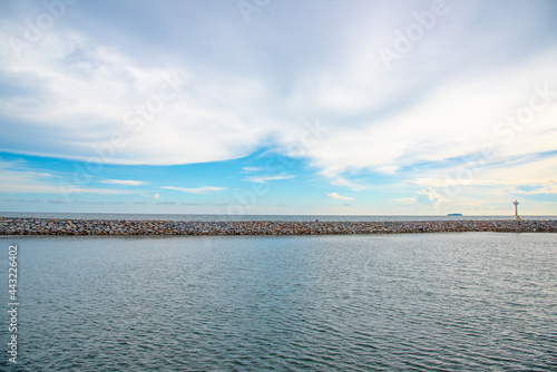 Nature in twilight period which including of sunrise over the sea and the nice beach. Summer beach with blue water and purple sky at the sunset.  