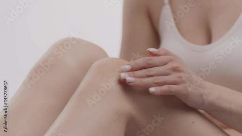 Wallpaper Mural Body care procedures. Close up shot of unrecognizable caucasian lady applying pampering lotion on legs skin Torontodigital.ca