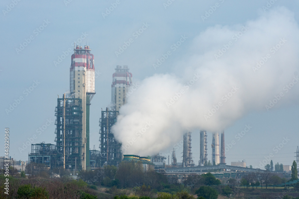 Industrial landscape. A fire at a chemical plant. Environmental threat, harmful emissions.
