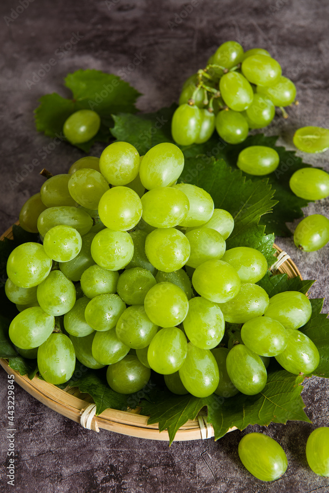 fresh ripe green grape on marble dark background. fresh ripe green grape on marble dark background.