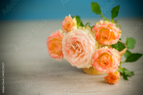 bouquet of beautiful orange roses on table © Peredniankina
