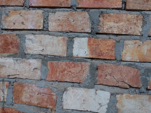 The walls of the residents' houses are made of bricks.