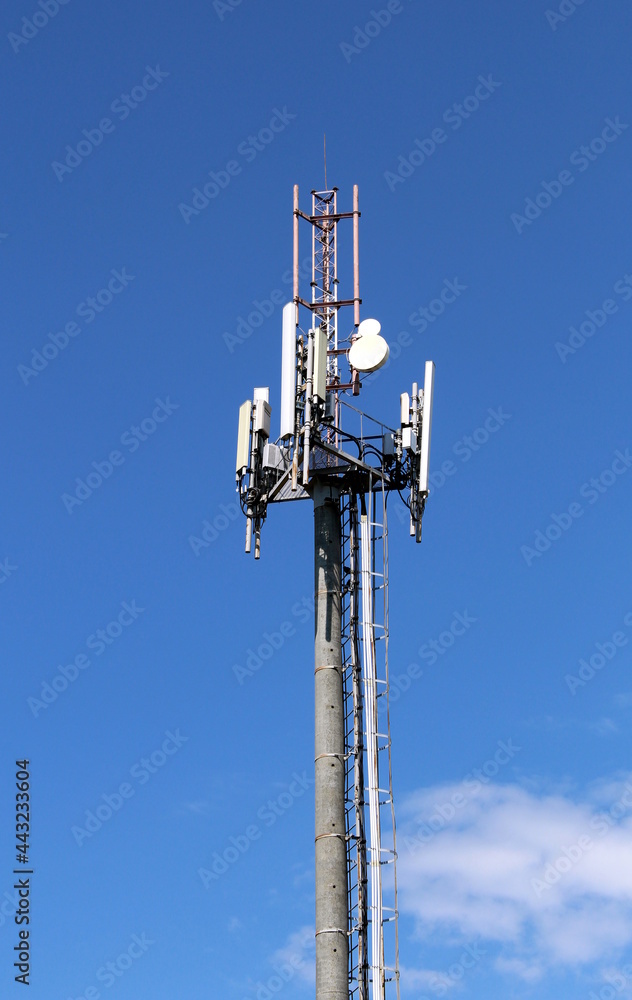 A tower for transmitting radio waves against a blue sky A tower for transmitting radio waves against a blue sky