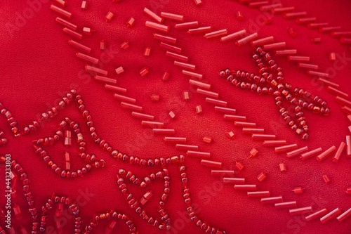 Bilde på lerret Red beaded fabric