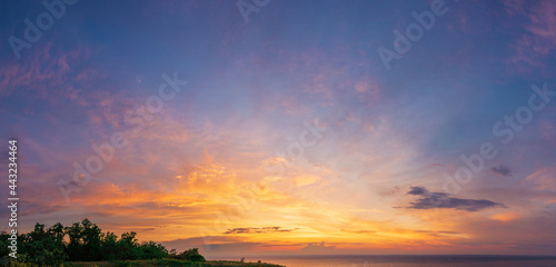 Fototapeta Naklejka Na Ścianę i Meble -  dramatic vibrant and saturated sky with beautiful clouds of sunset on the river bank