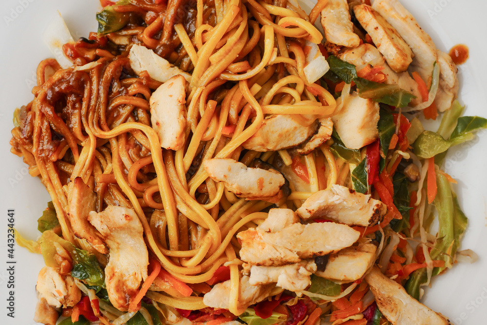 Chicken chow mein with noodle, close up. Asian style food range. Taste of Orient. Chicken chow mein with noodle, close up. Asian style food range. Taste of Orient.