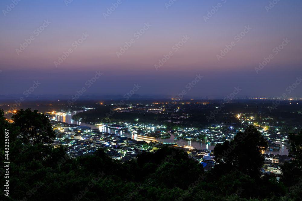 Pak Nam Chumphon town, fisherman village, and river from Khao Matsee scenic viewpoint during twilight, Thailand