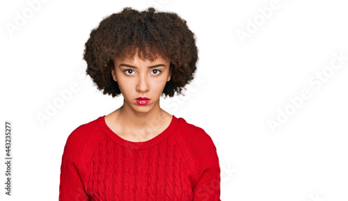 Young hispanic girl wearing casual clothes skeptic and nervous  frowning upset because of problem. negative person.