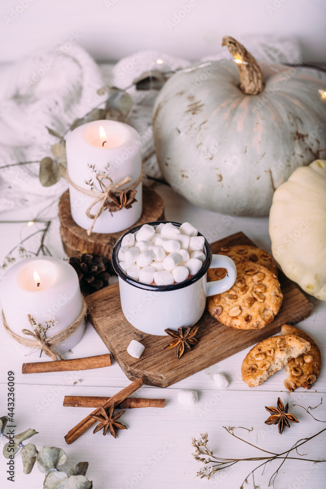Autumn composition with cocoa with marshmallows, cookies, pumpkin and candles. Autumn composition with cocoa with marshmallows, cookies, pumpkin and candles.
