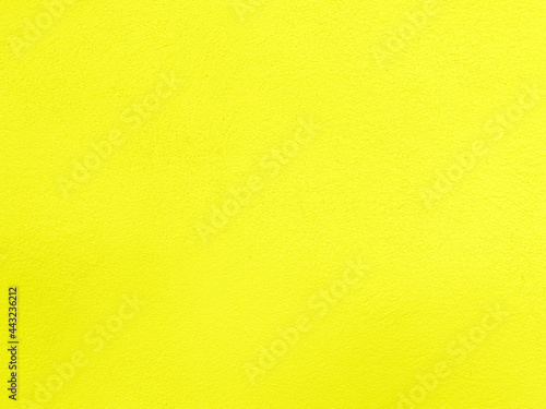 Seamless texture of yellow cement wall a rough surface, with space for text, for a background.