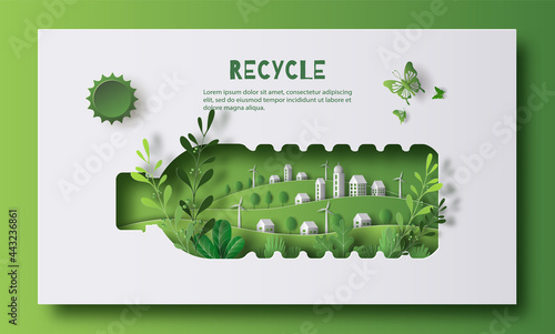 A bottle of water with a green city inside, the idea is to recycle old plastic bottles, think green, paper illustration, and 3d paper. photo