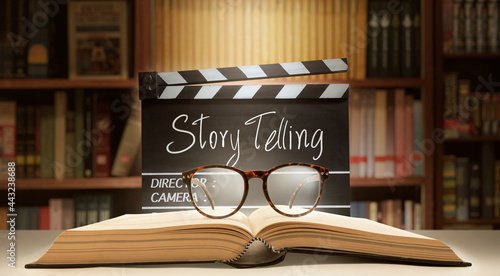 Storytelling concept.Film slate, book, and eyeglasses in the master class. photo