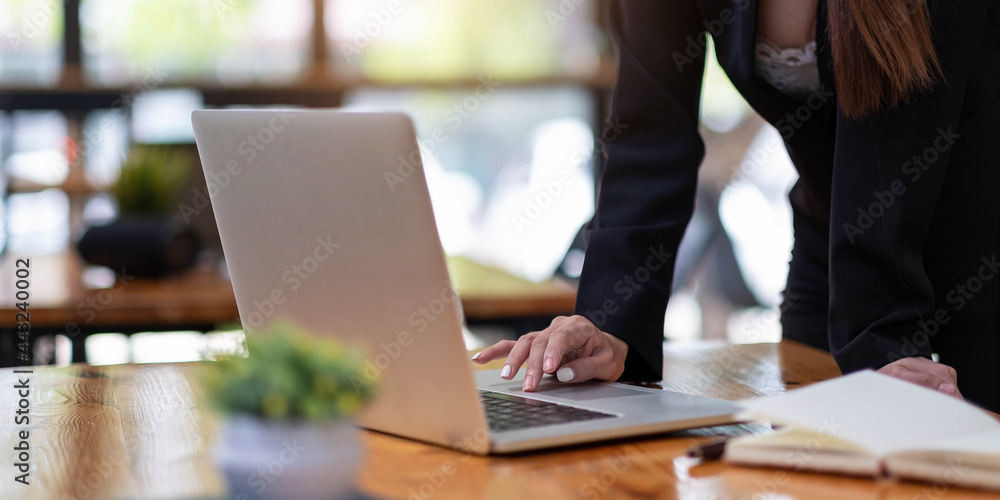 Close up woman using laptop computer on workplace Close up woman using laptop computer on workplace