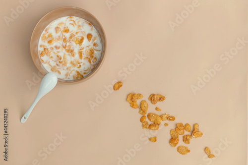 Breakfast with cereal in milk and fresh croissant