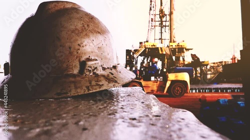 Dirty drilling fluids on the hardhat in the land rig working site