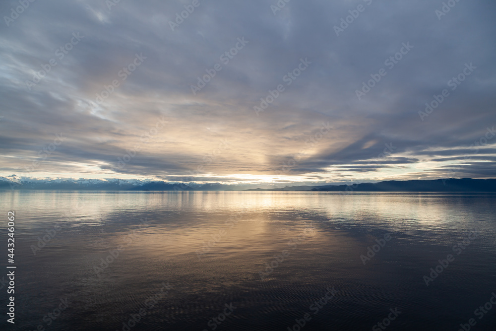 Sunset on mountains and sea in South East Alaska Sunset on mountains and sea in South East Alaska
