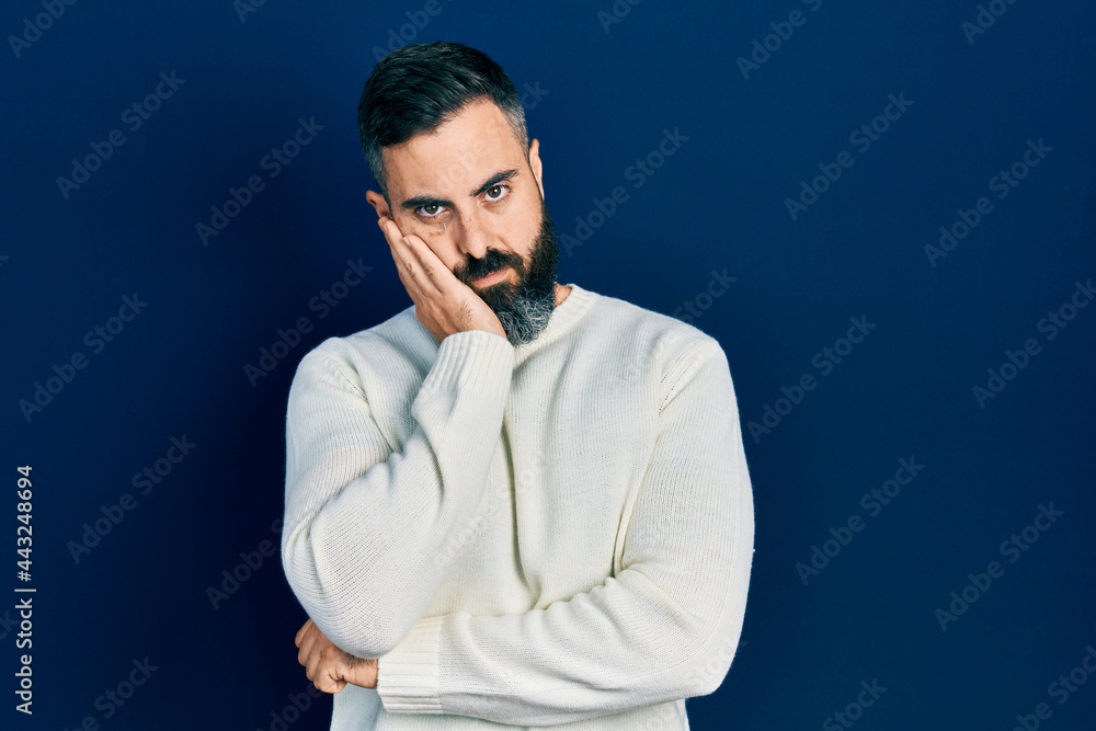 Young hispanic man wearing casual clothes thinking looking tired and bored with depression problems with crossed arms. Young hispanic man wearing casual clothes thinking looking tired and bored with depression problems with crossed arms.